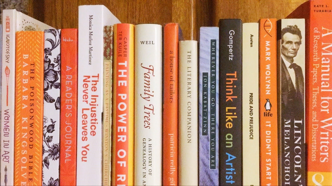shelf of mostly orange books